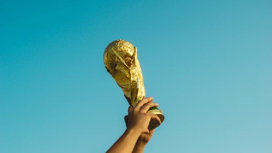The tournament trophy raised against blue sky